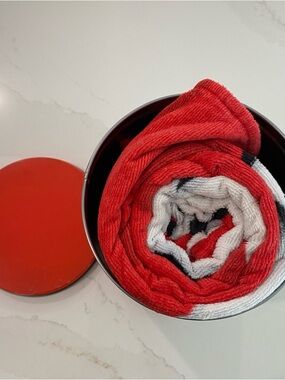 Coca Cola tin and towel, collectable